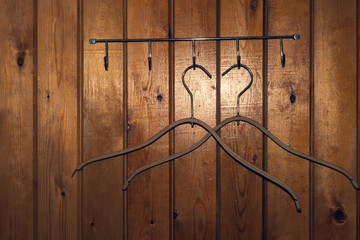 Fototapeta premium Hangers on wooden wall background. dress rack