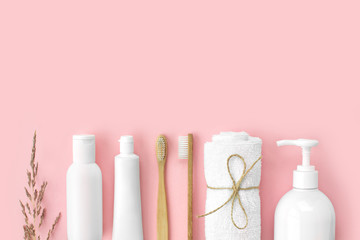Set of eco-friendly toothbrushes, toothpaste and other tools on pink background. Dental and healthcare concept. Top view, flat lay, free copy space.