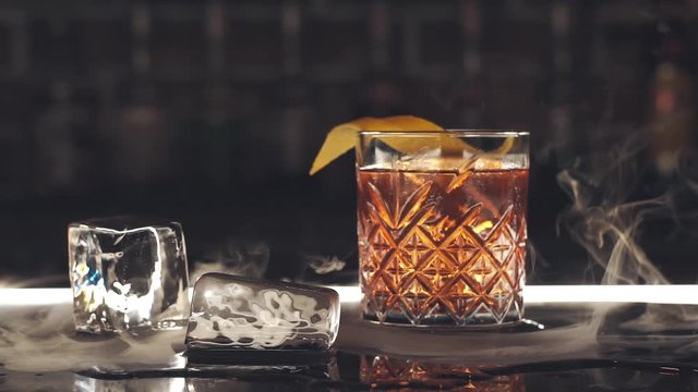 Cocktail with ice cubes on the bar