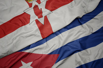 waving colorful flag of cuba and national flag of northern ireland.