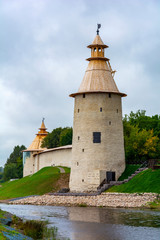 Fototapeta na wymiar Pskov, High and Vаrlamovskaya corner towers surrounding town at the mouth of the river Pskovа