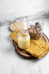 condensed coconut milk and Chocolate Shavings. Raw cacao mass