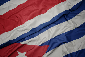 waving colorful flag of cuba and national flag of costa rica.