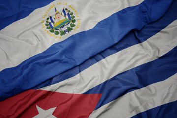 Fototapeta premium waving colorful flag of cuba and national flag of el salvador.