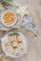 Homemade sweet white chocolate and coconut in a plate. Raffaello candy - snowball truffles on a Christmas table. Top view