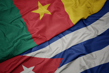 waving colorful flag of cuba and national flag of cameroon.