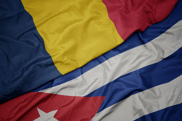 waving colorful flag of cuba and national flag of chad.