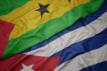 waving colorful flag of cuba and national flag of sao tome and principe .
