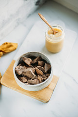 condensed coconut milk and Chocolate Shavings. Raw cacao mass