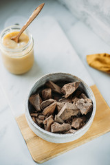 condensed coconut milk and Chocolate Shavings. Raw cacao mass