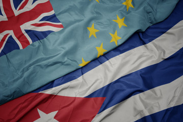 waving colorful flag of cuba and national flag of Tuvalu .