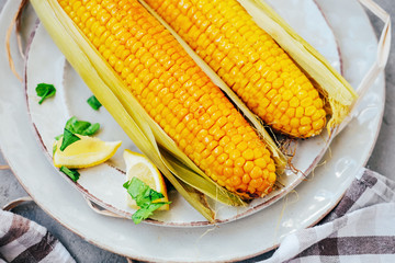 Traditional summer food. Baked corn cobs with spices.