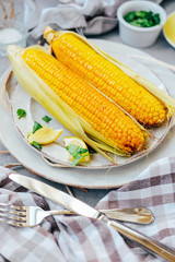 Traditional summer food. Baked corn cobs with spices.