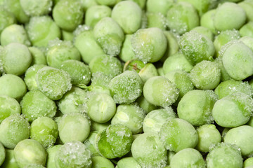 Frozen fresh peas with crystals ice macro closeup iced