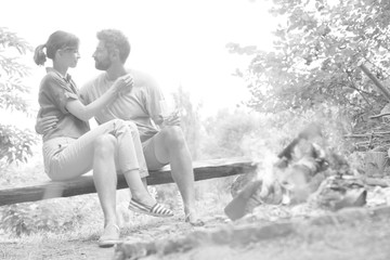 Tilt shot of romantic couple sitting at public park