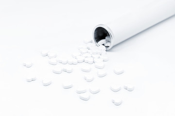 Closeup of white heart-shaped pills