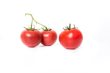 Cherry tomatoes. Three cherry tomatoes isolated on white background