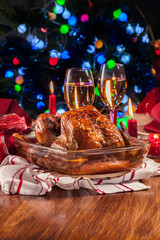 Baked or roasted whole chicken on Christmas table