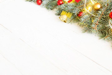 Fototapeta na wymiar Christmas fir tree with christmas decoration on a white wooden board