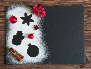 Christmas tree decorated with cranberries and snow from flour on the black background, Merry Christmas and Happy New Year