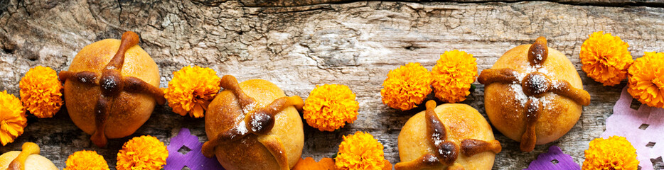Mexican celebration banner, bread of death. Mexican parties Dead bread and marigold flowers on...