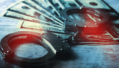 handcuffed money on the table