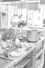 Black and white photo of Fresh vegetables on counter in kitchen at restaurant
