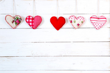 Garland of hearts on a wooden background. Valentine's Day