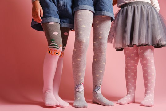 A woman wearing quirky, patterned tights with the shapes of leaves and  flowers on them Stock Photo - Alamy