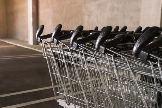 Row empty shopping carts are in parking lot