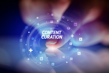 Obraz premium Finger touching tablet with social media icons and CONTENT CURATION