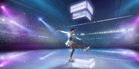 Figure skating girl in ice arena.