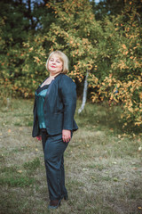 Mature plus size lady in Elegant suit at mature, older women lifestyle