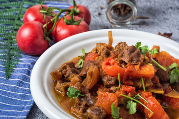 Chili con carne - in American English as simply chili, is a spicy stew containing chili peppers, meat (usually beef), tomatoes and often beans