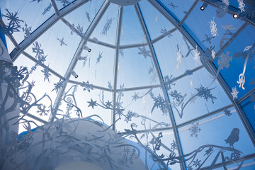 Winter snowflakes festive decoration against blue sky