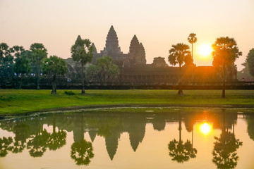 Angkor Wat at sunrise in the reflection of the lake