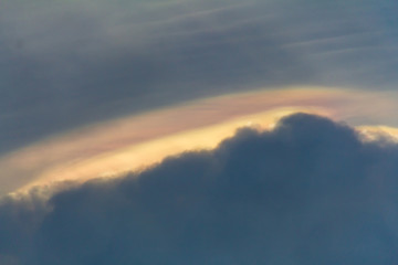 Beautiful iridescent cloud, Irisation. Skyscraper background