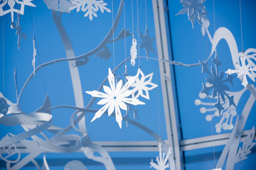 Winter snowflakes festive decoration against blue sky
