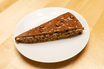 Delicious caramel and chocolate layered cracker toffee on table.