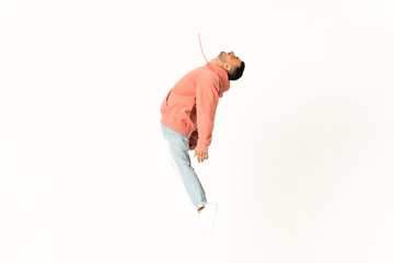 Man dancing street dance style over isolated white background