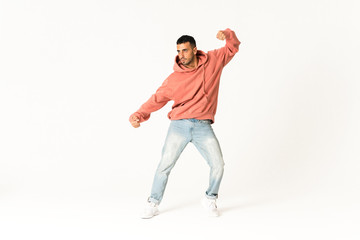 Man dancing street dance style over isolated white background