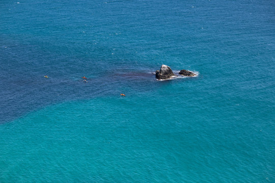 Seascape with canoes