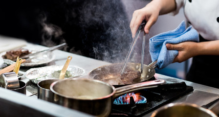 Chef cooking food in the kitchen, Chef preparing food