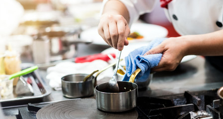 Chef cooking food in the kitchen, Chef preparing food