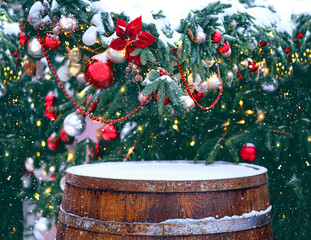 vintage wooden barrel and festive christmas tree. Old wooden barrel and fir tree branches, colorful...