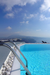 Beautiful pool in picturesque village of Imerovigli with great caldera view, Santorini island, Cyclades, Greece