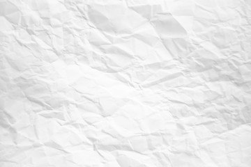 white and gray wide crumpled paper texture background. crush paper so that it becomes creased and wrinkled.