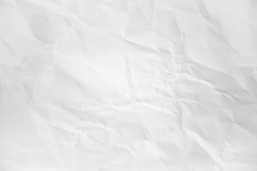 white and gray wide crumpled paper texture background. crush paper so that it becomes creased and wrinkled.