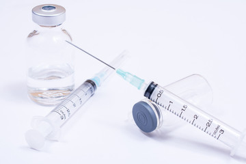 Syringe with droplet and medical on white background. Medical equipment used for surgery.