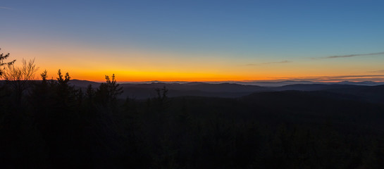 Obraz premium Panoramic view from lookout Nebelstein with distant hill, blue hour, Austria landscape